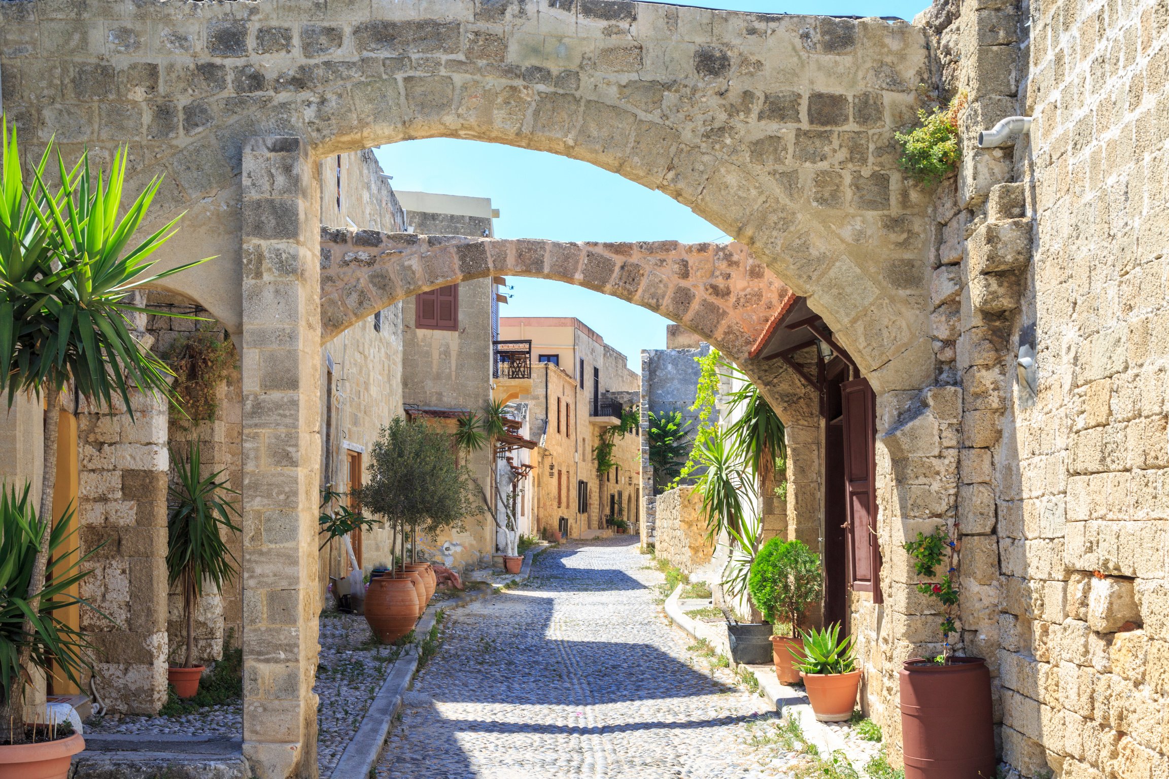 Historical streets of old town Rhodes with flowers in Rhodes, Dodecanese, Greece