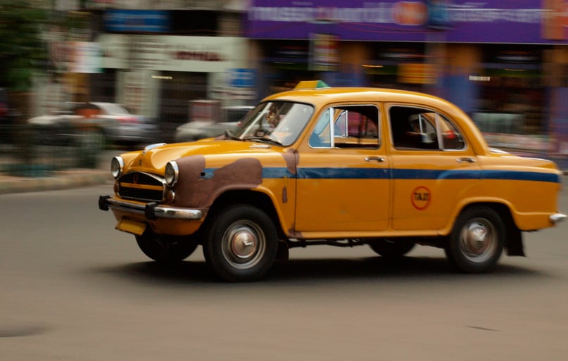 old indian taxi in movement